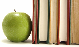apple and books on desk